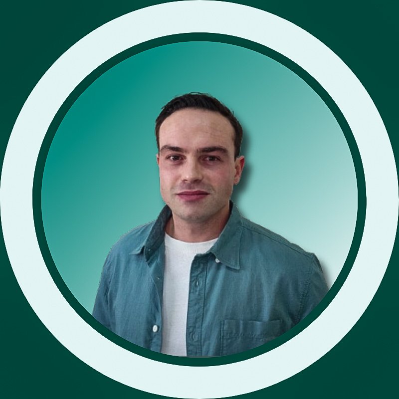 Professional headshot of Lyle van Tonder, digital marketer and owner of Lyle Writes UAE hiking blog, wearing a light blue shirt against teal background.